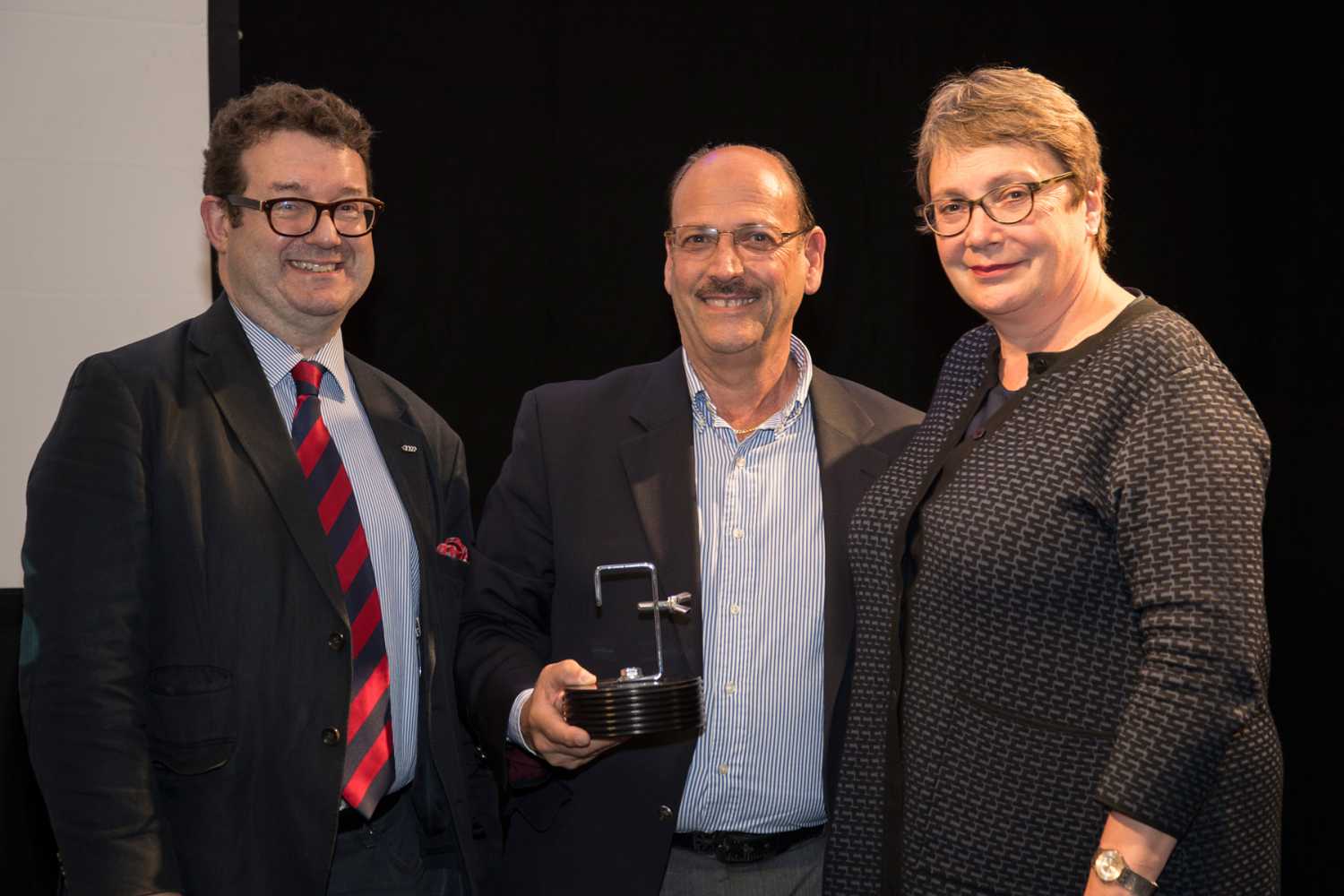 Robin Townley, CEO ABTT, with Gary Vilardi, vice president of sales, City Theatrical, receiving the ABTT Lighting Product of the Year 2017 Award, with ABTT chairwoman Louise Jeffreys