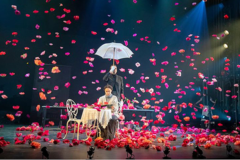 Electro Kabuki drops hundreds of flower heads to the RADA Jerwood Vanbrugh stage to mark a scene change in a performance of The Importance of Being Earnest.
