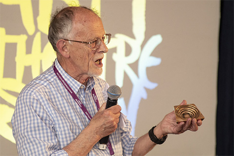 Tony Jackon at the ABTT Theatre Show announcing the Stephen Joseph Award 2022 open