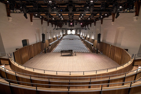 The renovated Concert Hall retains its original wooden curved frame roof and exterior walls (photo: Bijloke Music Centre)
