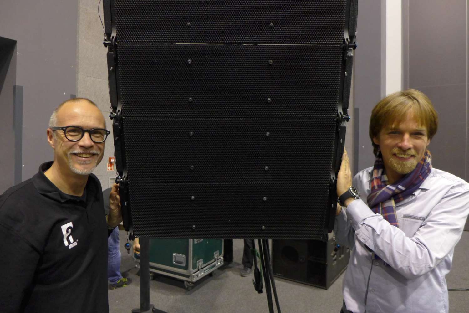 Tom Back of Alcons Audio (left) and Grzegorz Fotek of Aplauz Poland flanking the LR18 pro-ribbon line-array