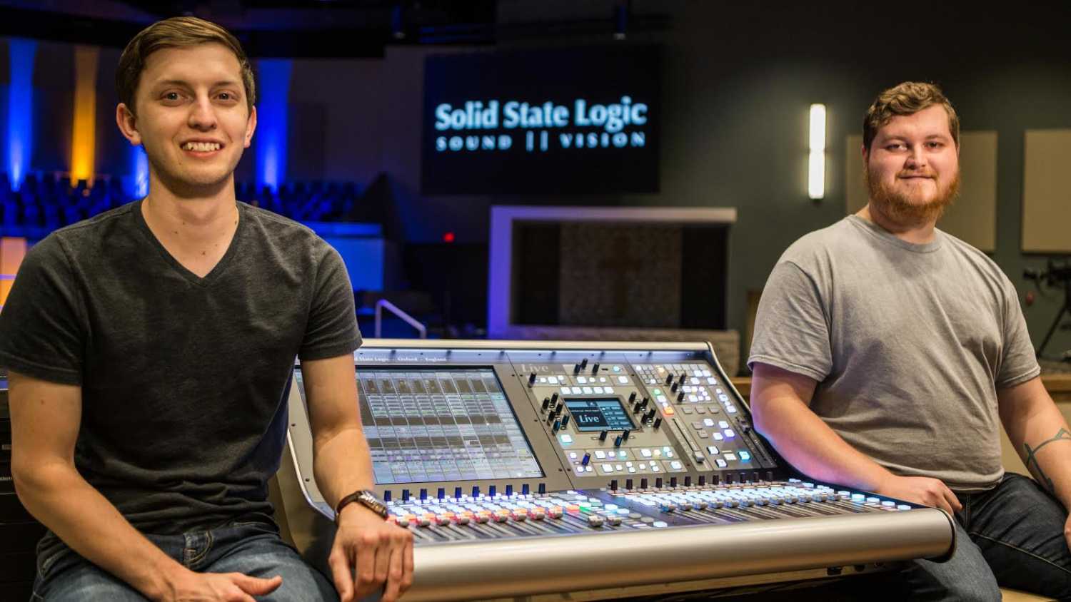 Rusty Trowbridge, technical director (left) and Spencer Wells, AV Technician with one of the new SSL L300 Live consoles