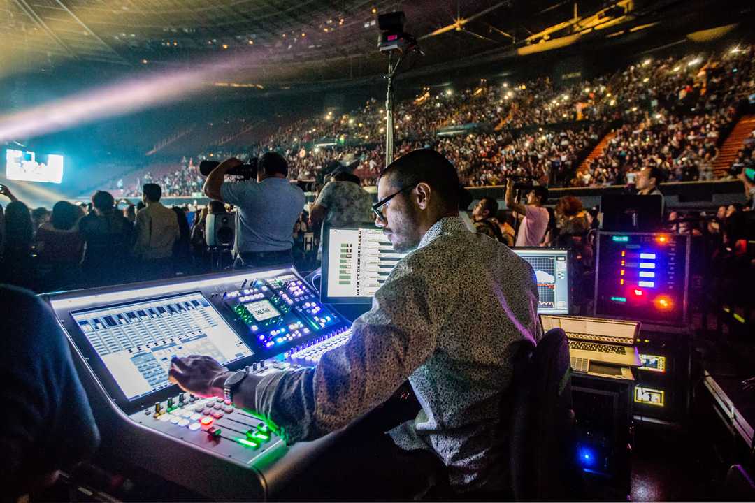 Front Of House Engineer Dani Munoz with the SSL Live L300 console