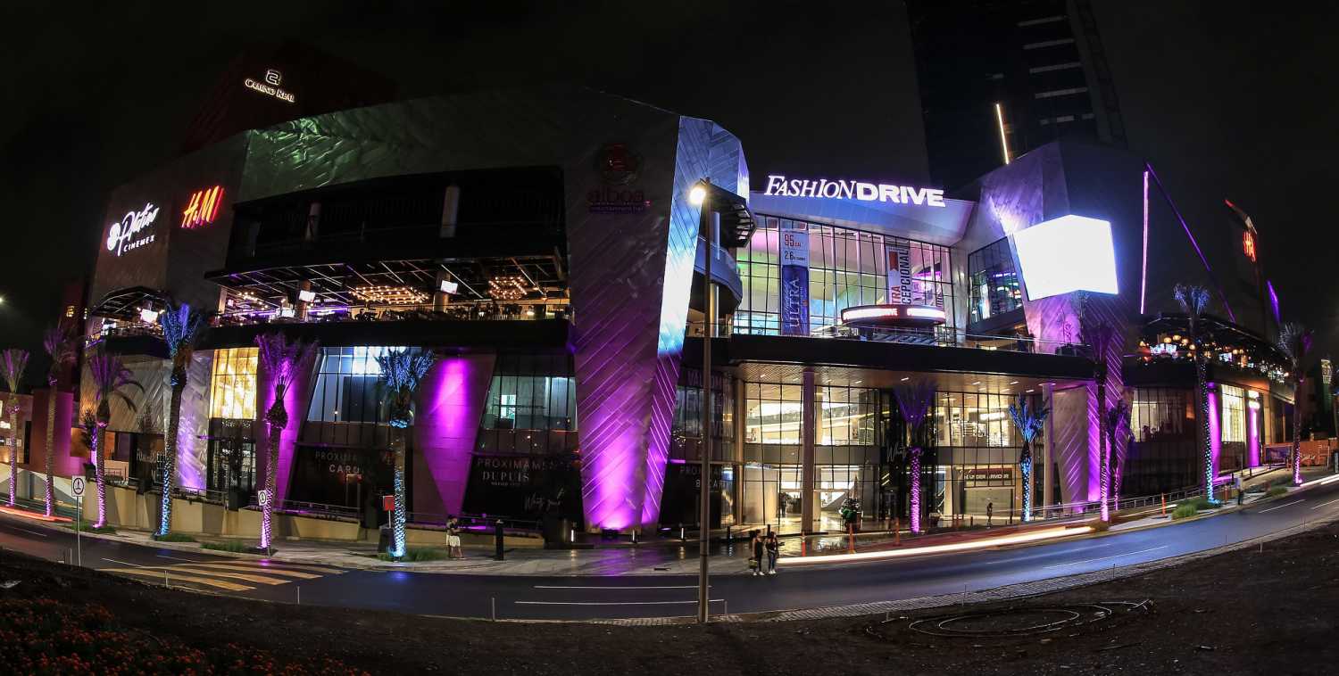 The modern shopping mall features top fashion brand stores and stretches across four levels