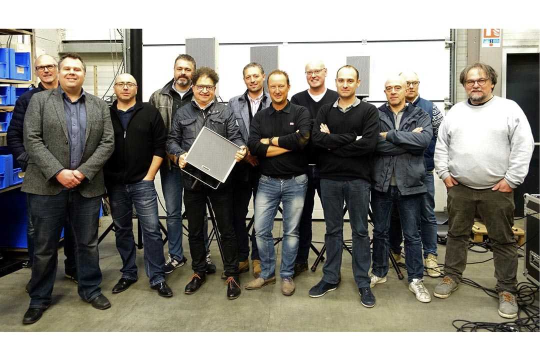 The DV2 team with Community’s EMEA sales manager, Jamie Ward  and Guy Vignet, president of DV2, holding loudspeaker