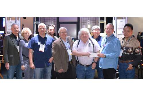 Lance Hughston, Sr. (fourth from right) and Rick Rudolph, BTS chair (second from right) with Hughston Engineering staff and members of the BTS Board of Directors
