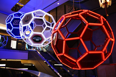 The trio of footballs needed to appear to float effortlessly within the atrium