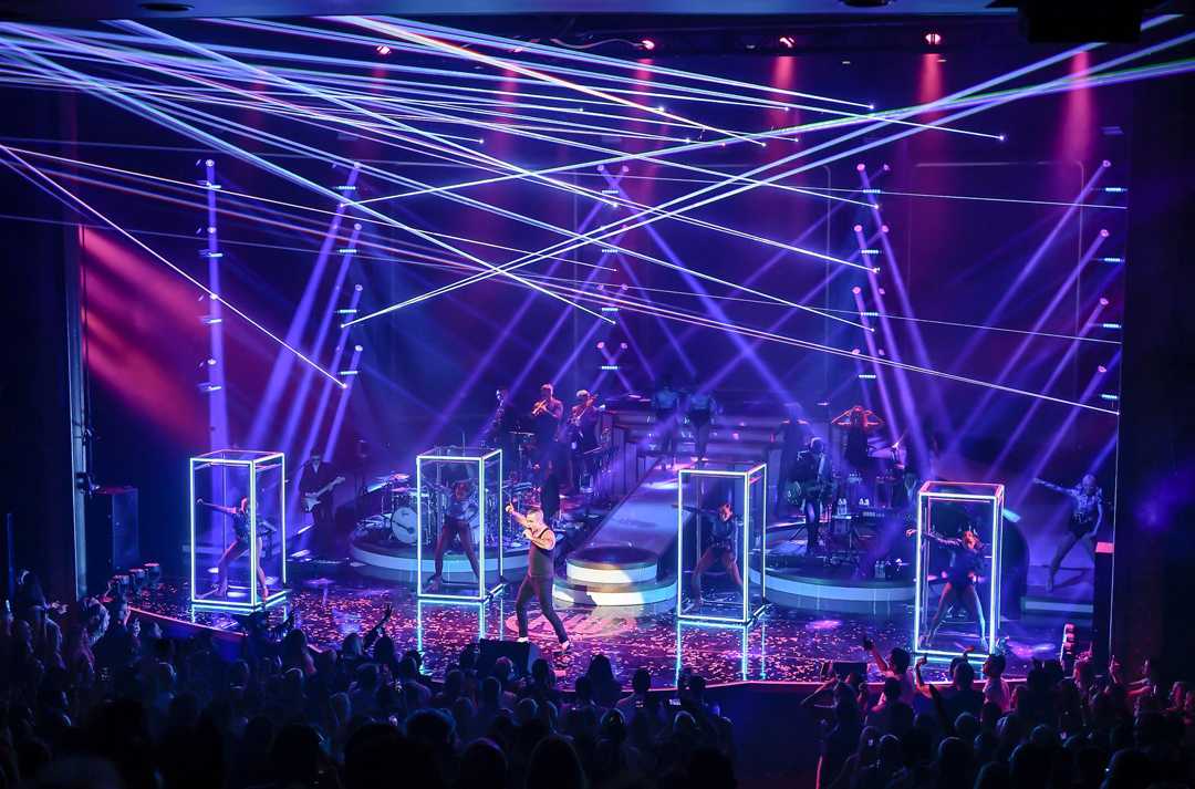 The dancers push around and dance inside the Gogo frames