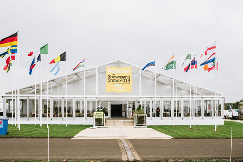 International flags flying at The Showman’s Show entrance