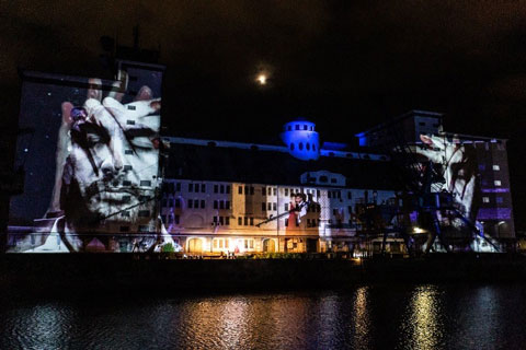 Digital Projection’s Titan Laser 37000 projected visuals onto the Municipal Warehouse facade I Photo: Christina Iberl