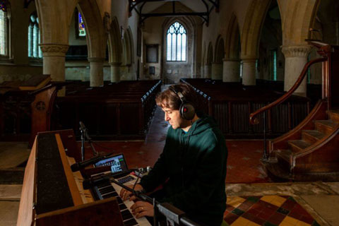 George Moorey recording in the 12th Century St Nicholas church