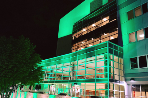 The hospital was lit in green as a sign of compassion for victims of COVID-19