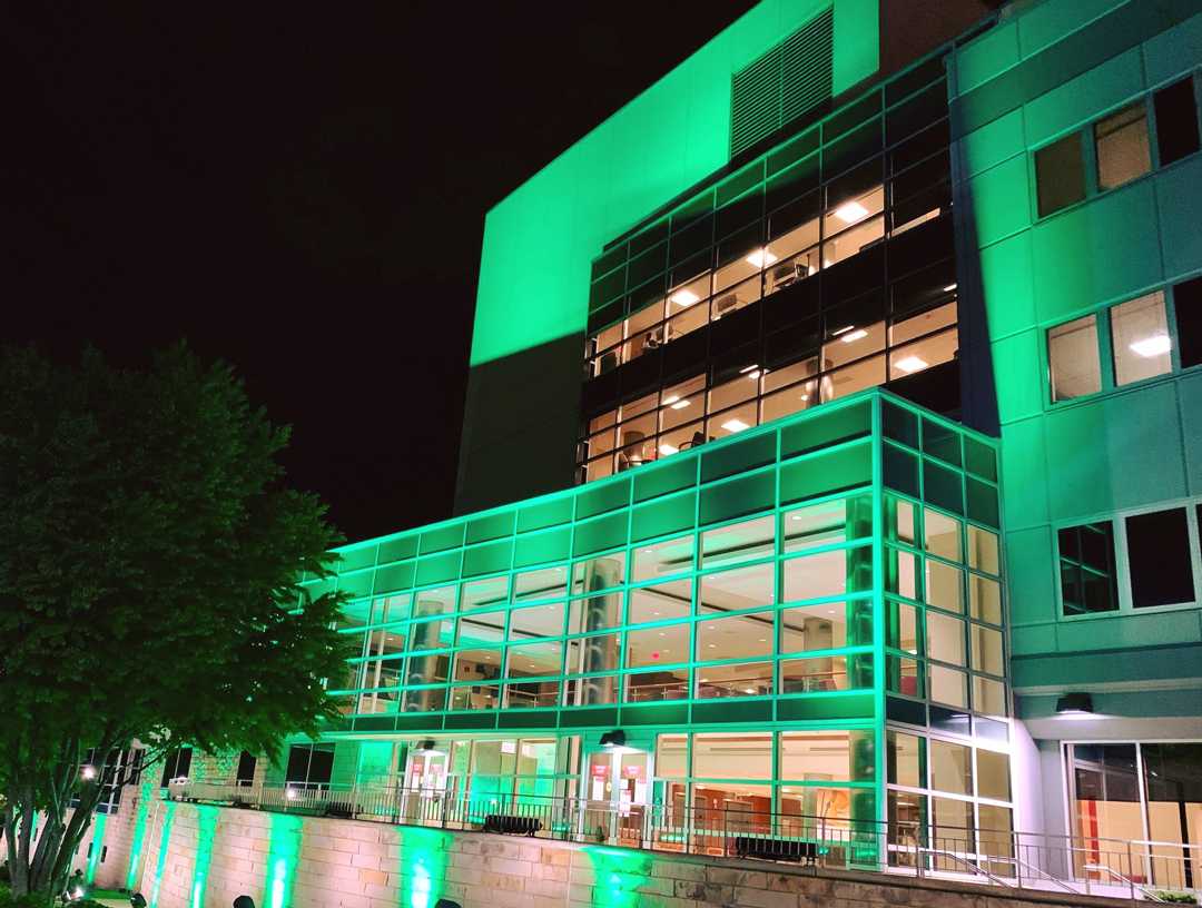The hospital was lit in green as a sign of compassion for victims of COVID-19