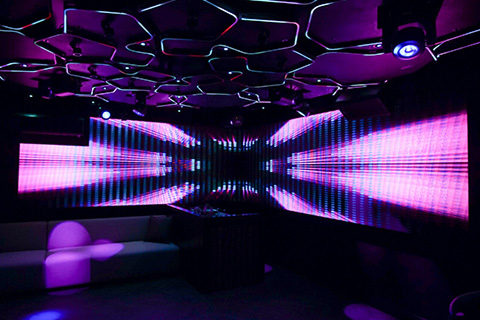 Fifteen wood panels are attached to the ceiling, each containing a section of Firefly FloppyFlex LED Neon