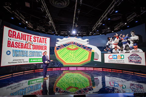 The key to creating a welcoming mood in the broadcast was a massive curved video wall backdrop
