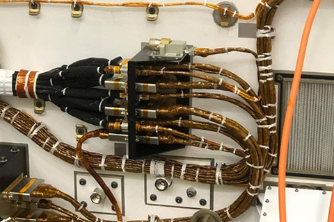 The DPA 4006 affixed atop the cable bracket aboard the Mars Perseverance Rover