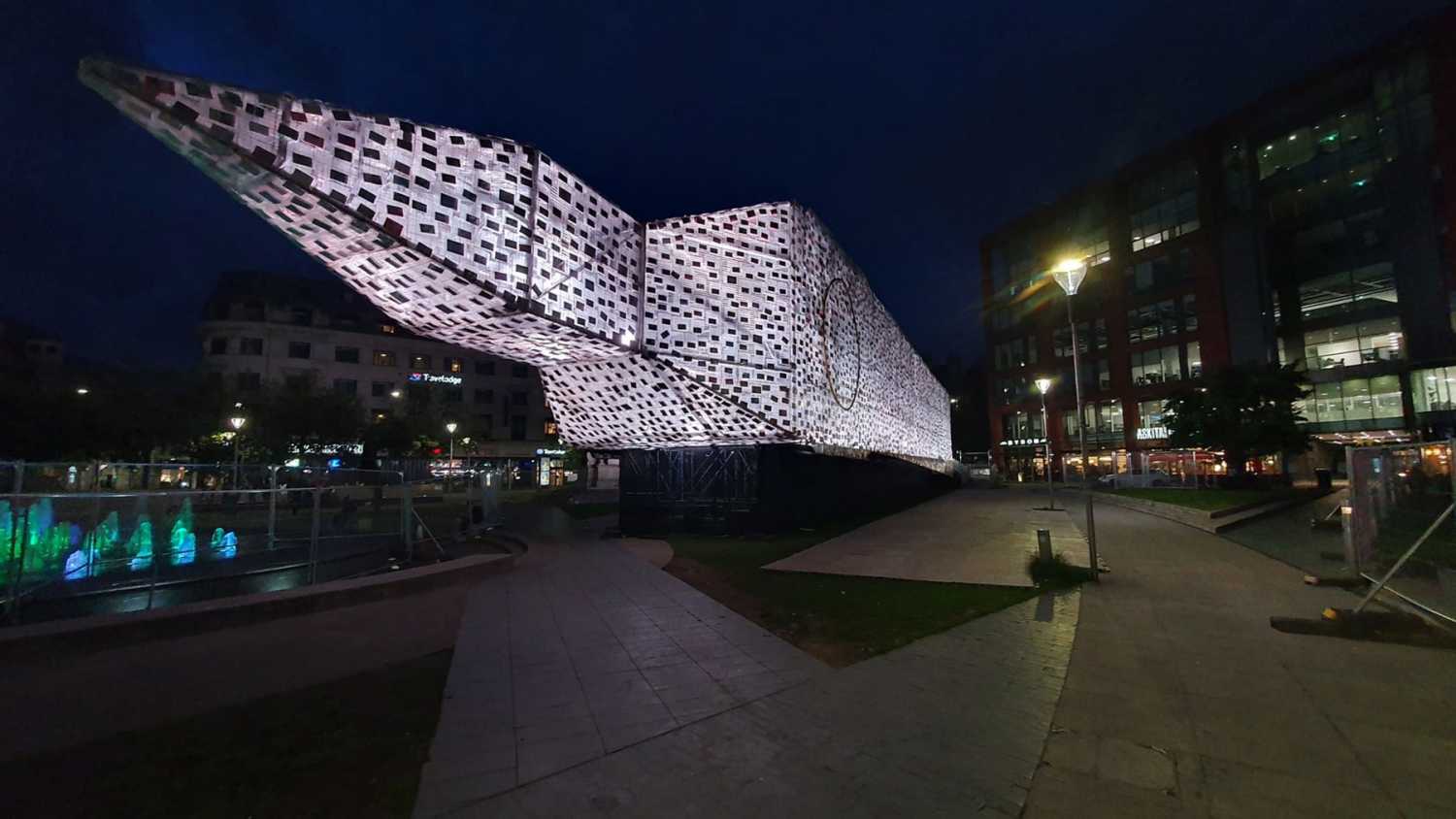 The work takes the London landmark and turns it on its side in Piccadilly Gardens