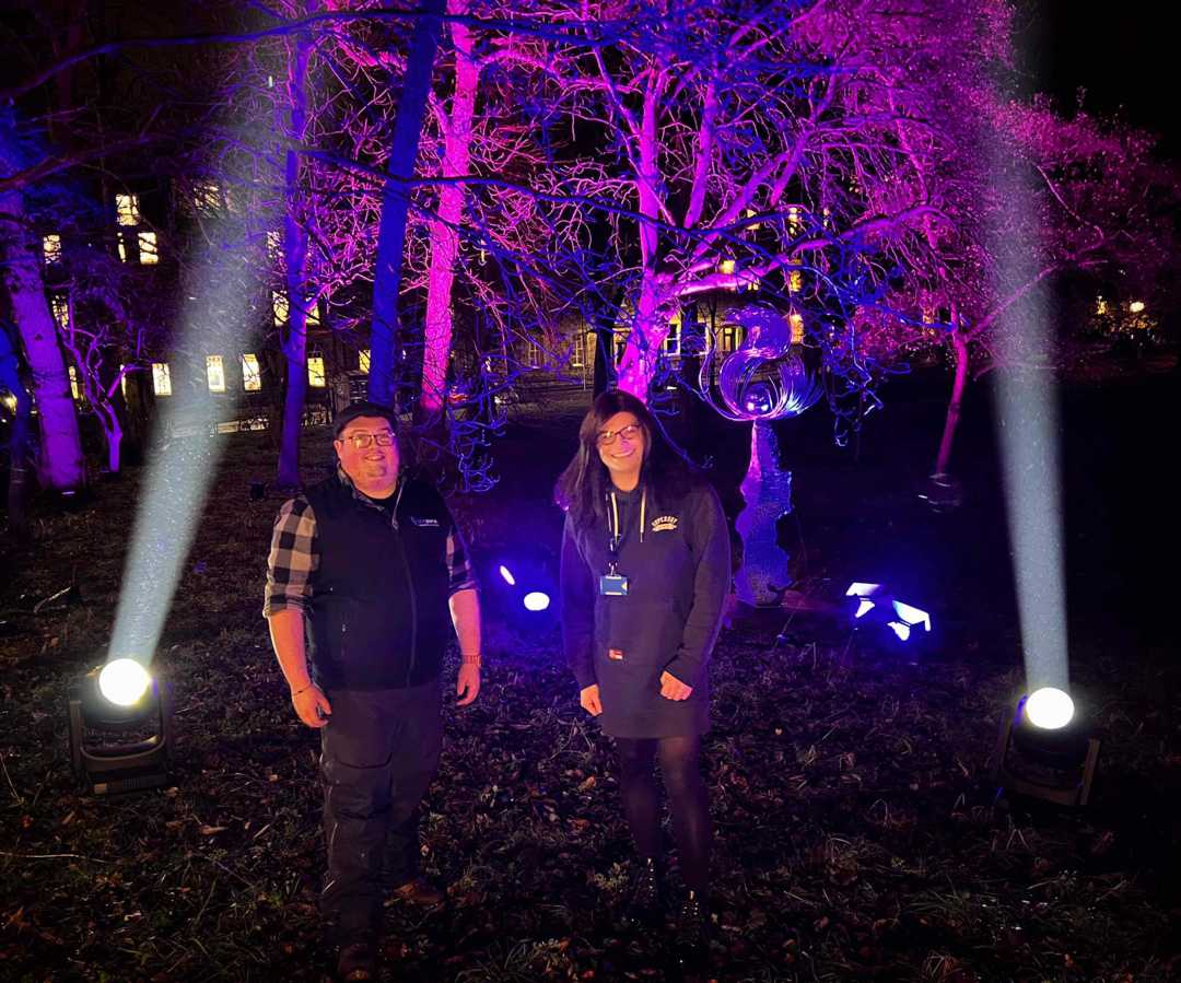 Blue Parrot’s production manager, Rhys Thomas, and managing director, Rebecca Clough, with their new Perseo Beam fixtures in the rain