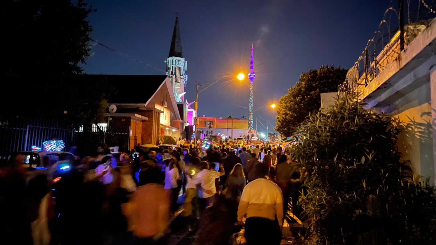 The community-led parade winds through the streets and features singers, dancers and bands