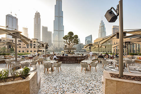 The restaurant overlooks the Burj Khalifa and the Dubai Fountains