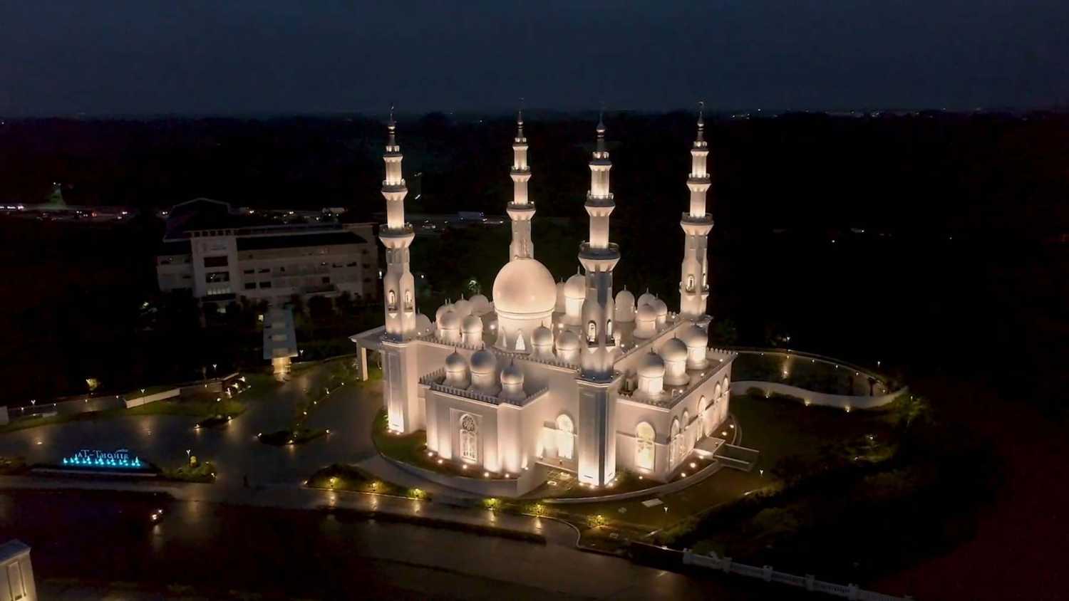 The pearlescent house of worship features 29 domes meant to signify family